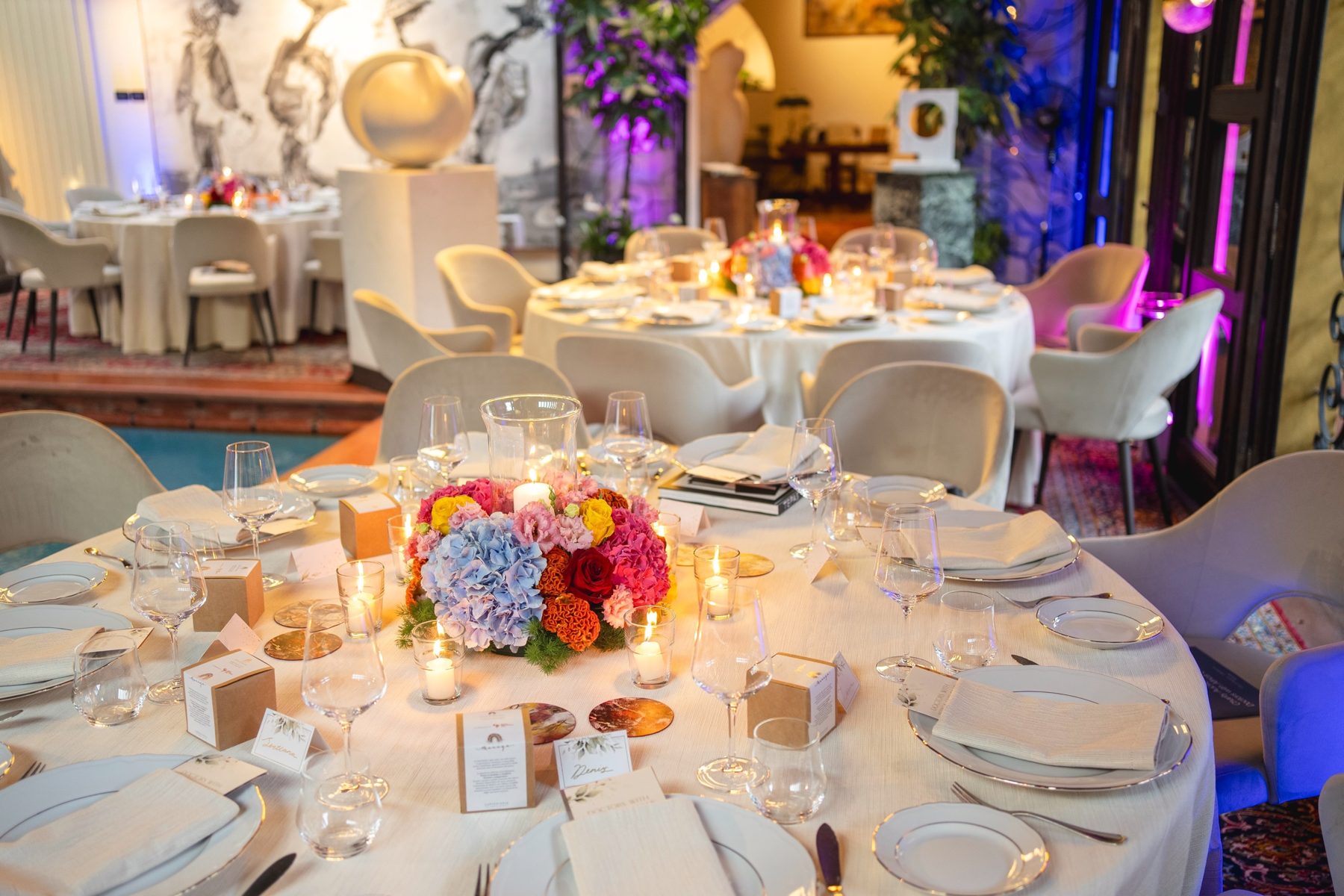 The dining room set for the art auction, with artwork on the walls