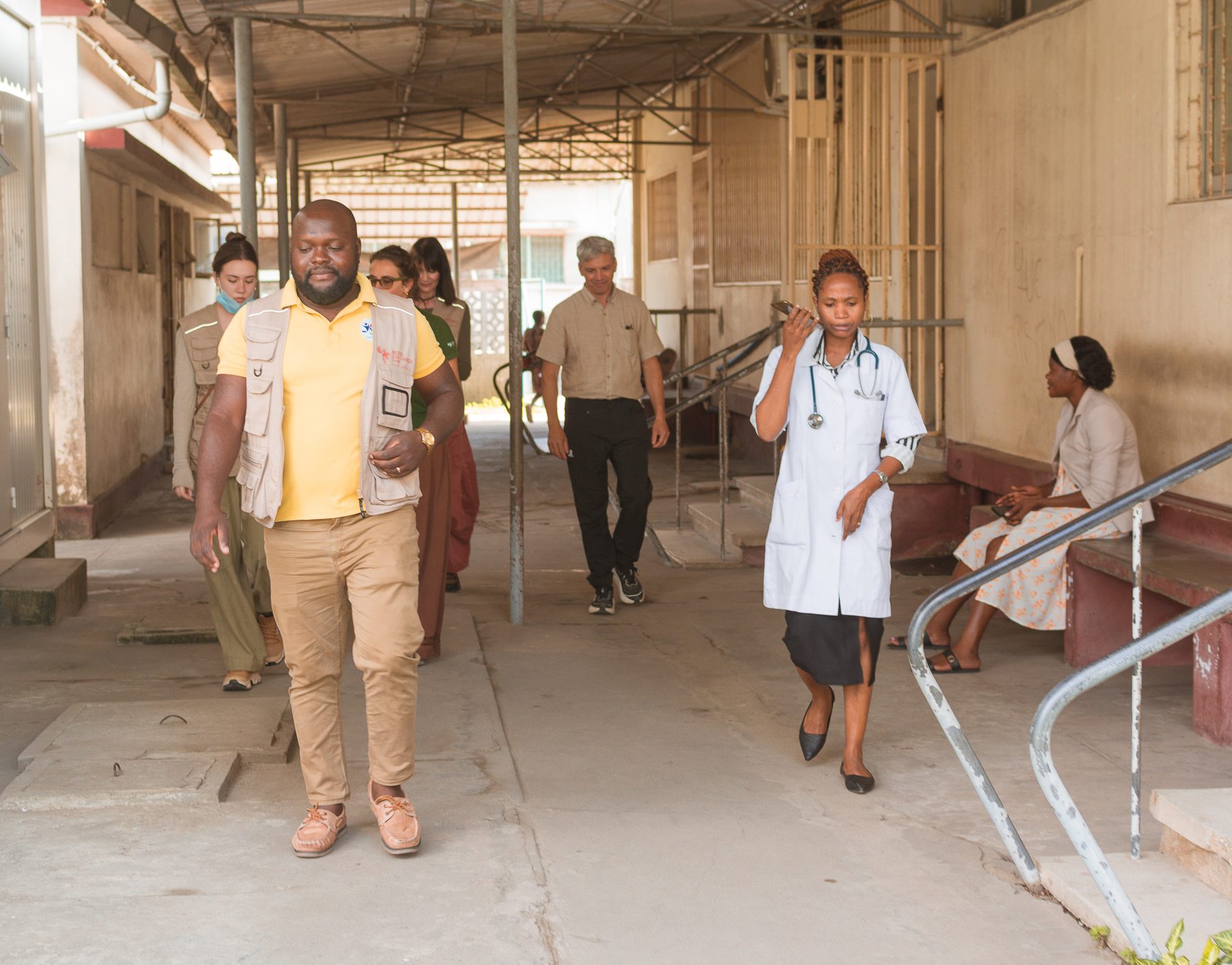 Team walking through a hospital with local medical staff in Beira