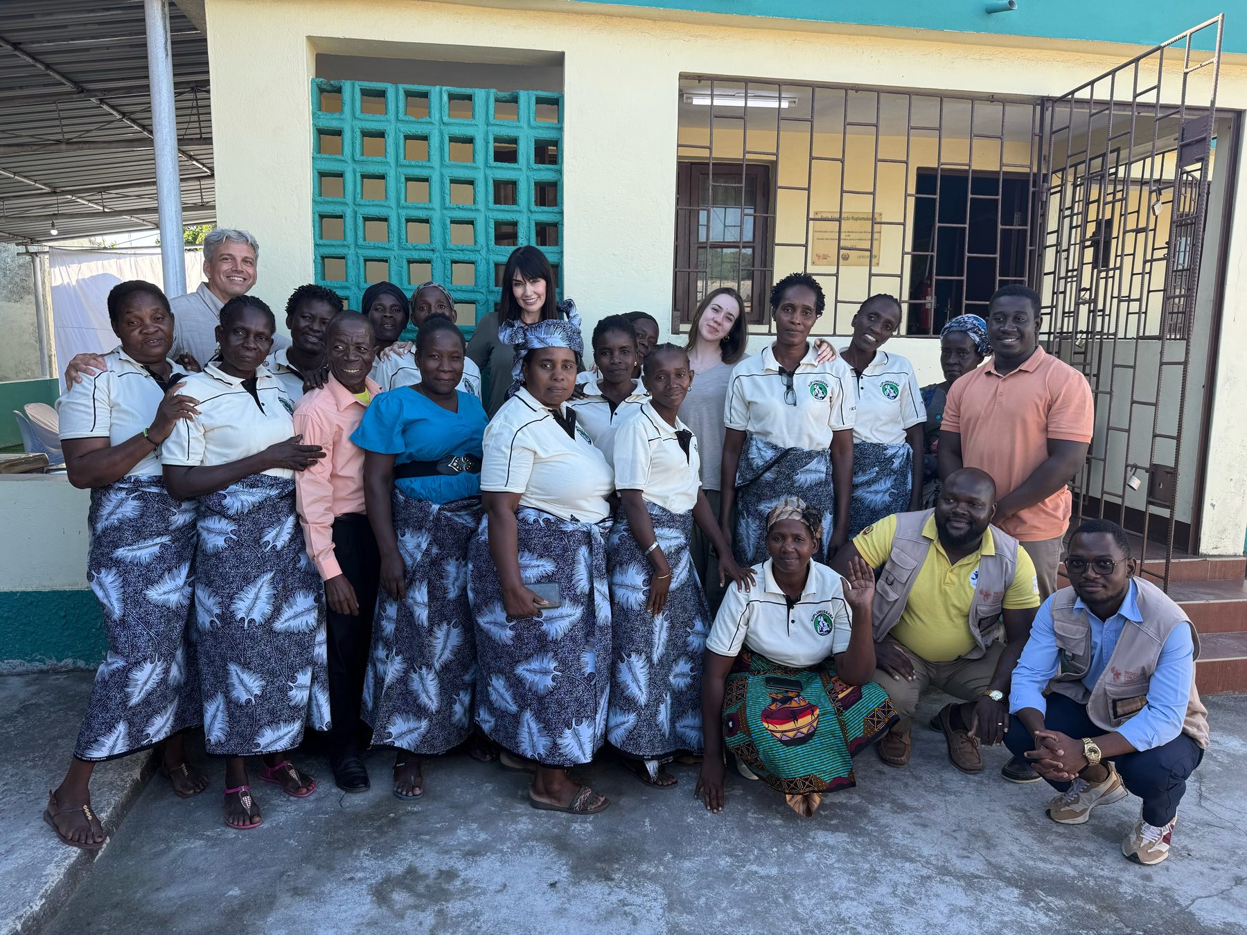 Community group and team gathered at a local association in Mozambique